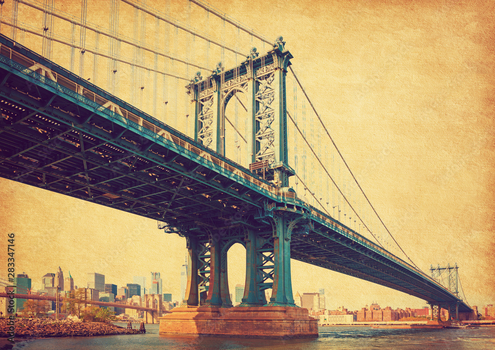 The Manhattan Bridge, New York City, United States. In the background  Manhattan and  Brooklyn Bridge. Photo in retro style. Added paper texture.