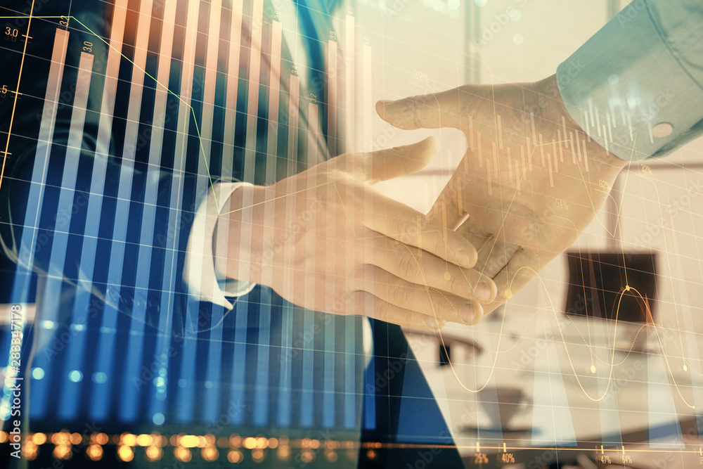 Multi exposure of financial graph on office background with two businessmen handshake. Concept of success in business Multi exposure of financial graph on office background with two businessmen handshake. Concept of success in business