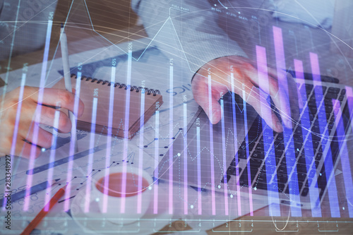 Wallpaper Mural Forex graph with businessman working on computer in office on background. Concept of hardworking. Double exposure. Torontodigital.ca