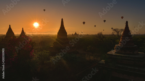 Hot air balloons floating at sunrise over Bagan  Myanmar, © Krzysztof Wiktor