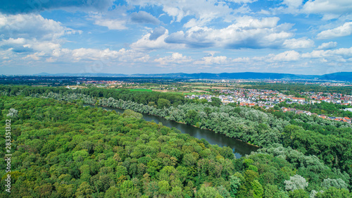 Aerial View of Green Park and River with City in Background