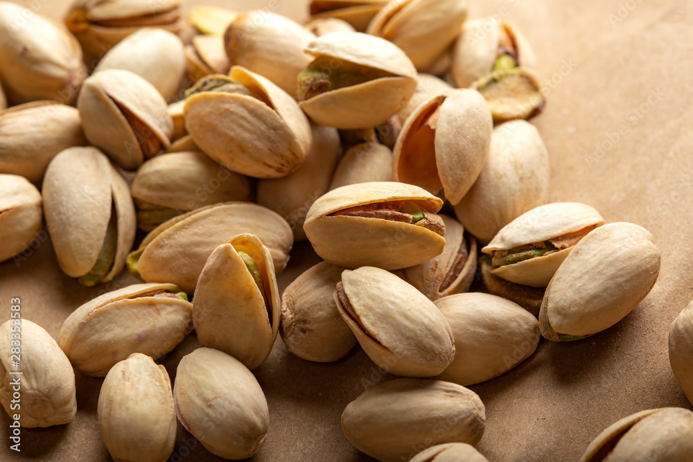 Fried and salty pistachio on paper Fried and salty pistachio on paper