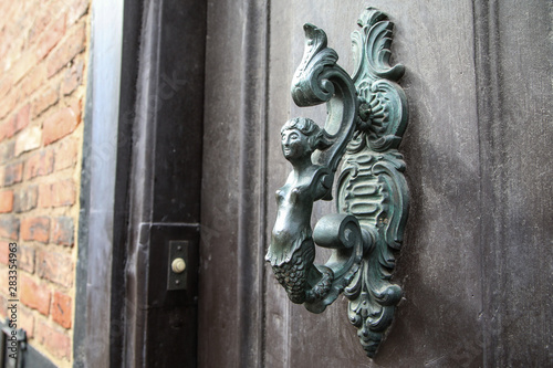 A detail of the old ornamental door handle. Nice example of the artificial detail on onld houses. 