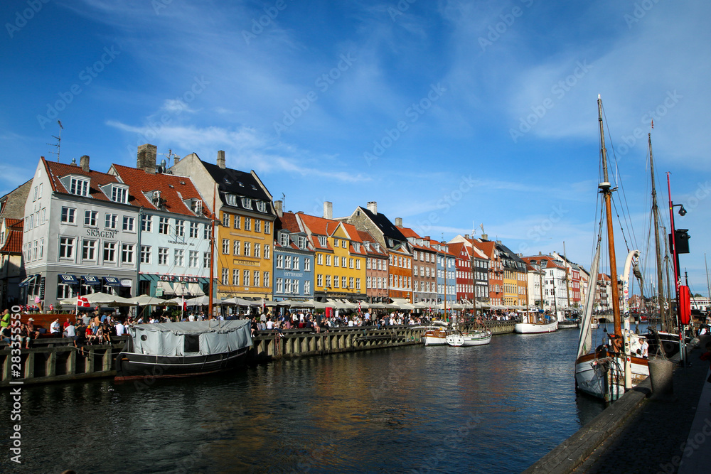 The famous beautiful Nyhavn harbor in Copenhagen in Denmark with its colorful houses. 