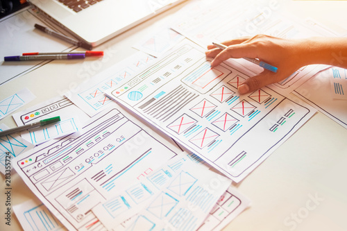 Website designer Creative planning application developer development draft sketch drawing template layout prototype framework wireframe design studio . User experience concept .