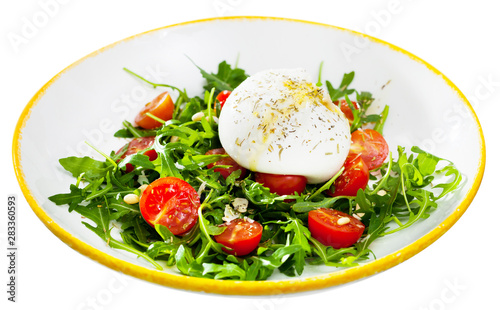 Image of salad with burrata italian cheese, arugula and cherry tomatoes