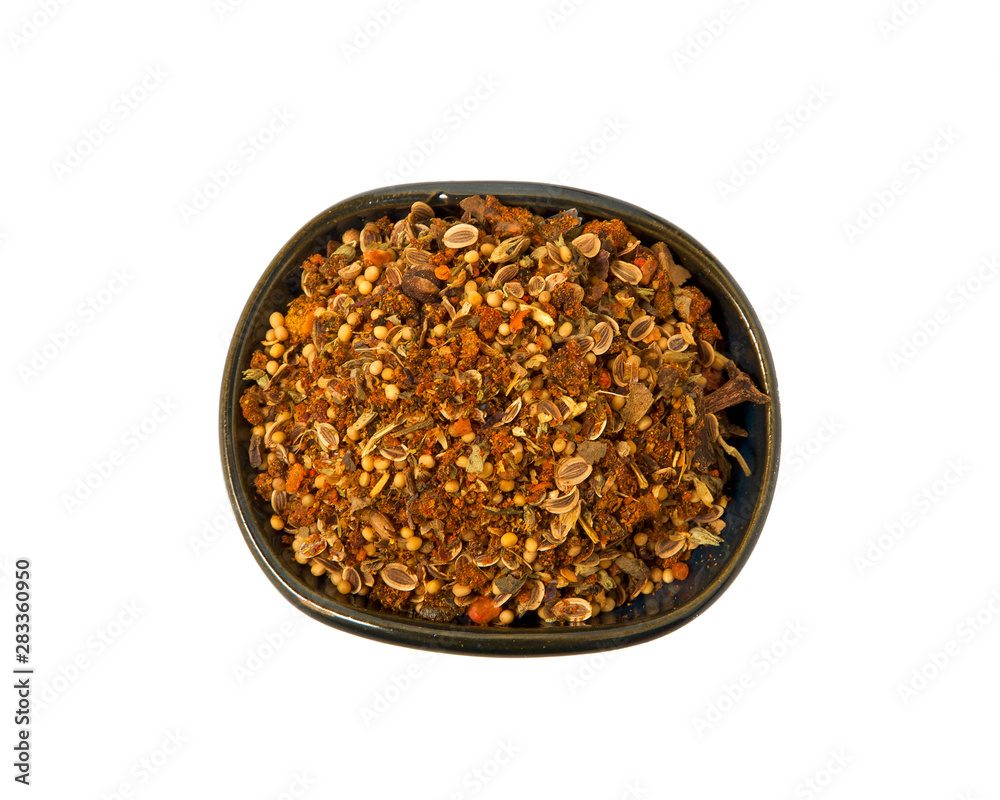 A mixture of seasonings in a bowl isolated on a white background. Spice on isolate. View from above. A mixture of seasonings in a bowl isolated on a white background. Spice on isolate. View from above.