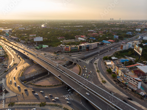 Aerial top view circular junction city transport road with car movement