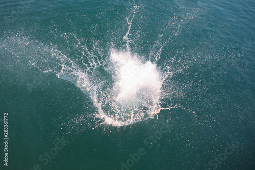 big splash in lake water view from above © phpetrunina14