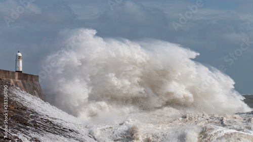 Large ocean waves and breaking waves on the Welsh coastline (Porthcawl, Wales)