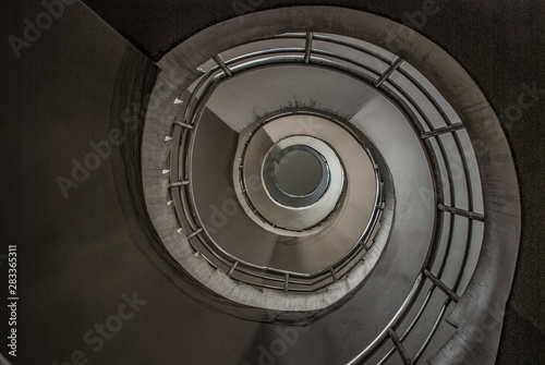 The spiral staircase detail in a beautiful of the building.
