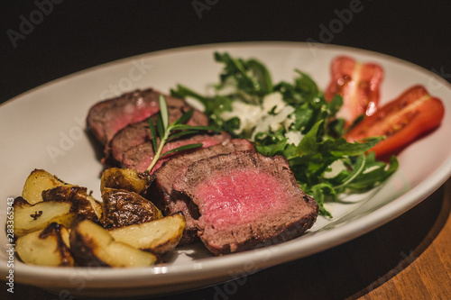 Free Range Grass Fed Tenderloin served with roasted potatoes and rucola salad