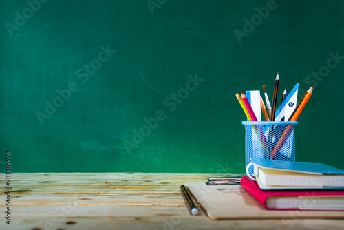 Back to school concept. colored pencil, and supplies  on wooden table