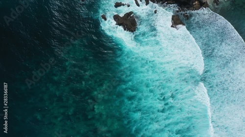 Waves breaking over a reef from above
