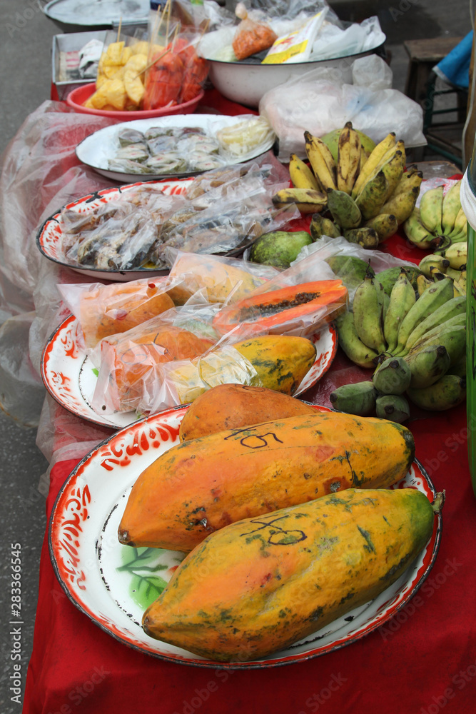 Many different kinds of fruits on the table ready for sale in the market.