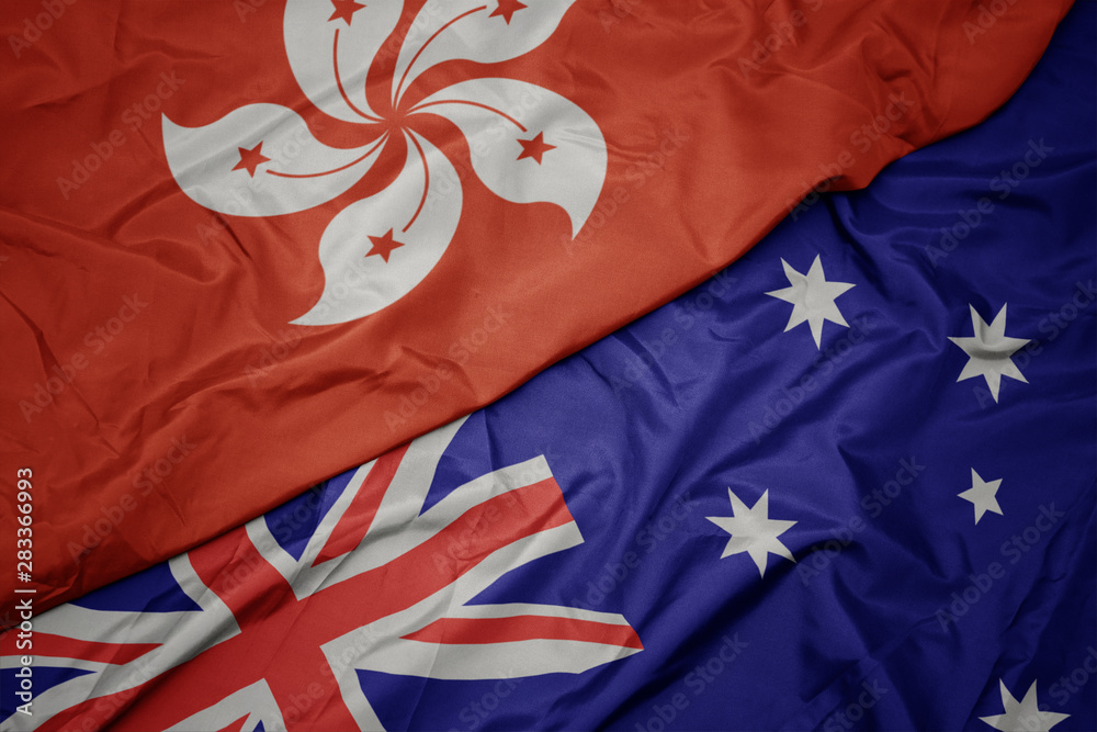 waving colorful flag of australia and national flag of hong kong. waving colorful flag of australia and national flag of hong kong.
