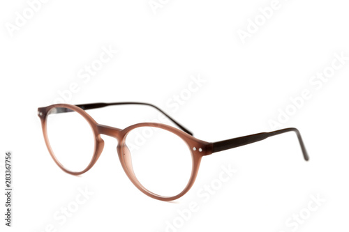 Brown plastic eyeglass frames . Isolated