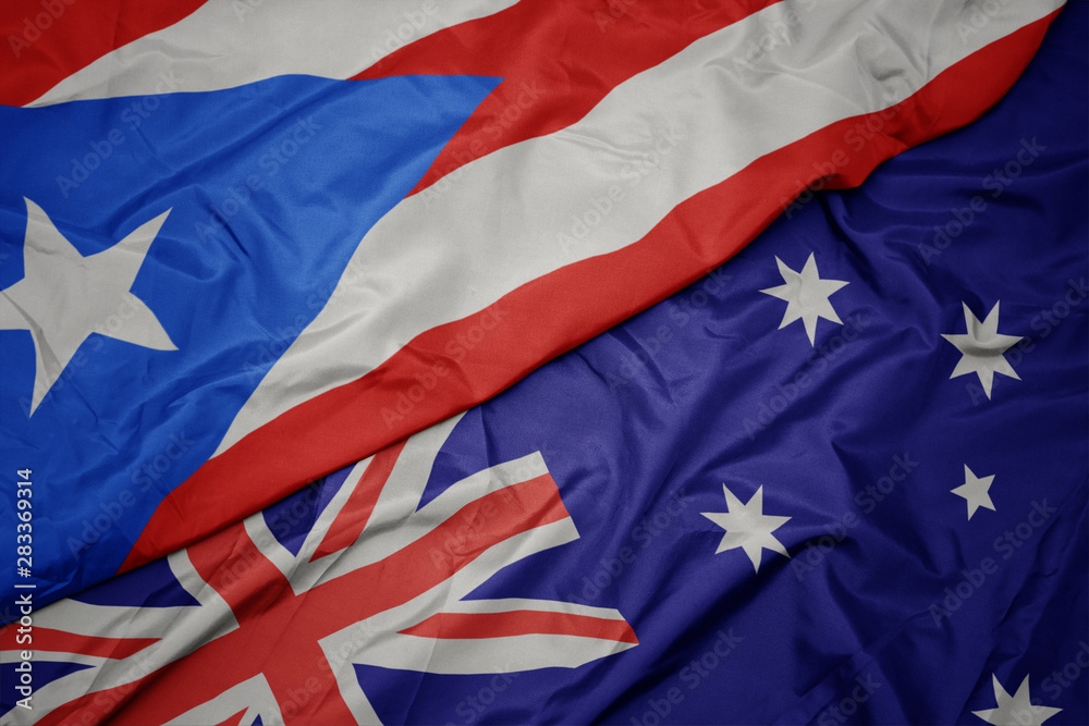 waving colorful flag of australia and national flag of puerto rico. waving colorful flag of australia and national flag of puerto rico.