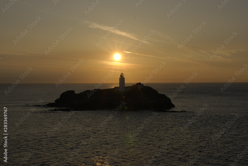 Sunset ocean over small island