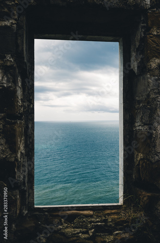 window old ruined building sea