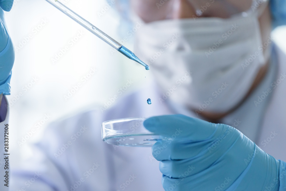 Asian senior scientist male researching and learning in a laboratory.