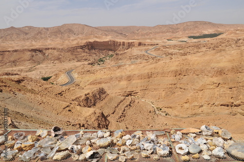 Geodes and panoramic view towards Tamerza and Mides mountain Oasis, western Tunisia photo