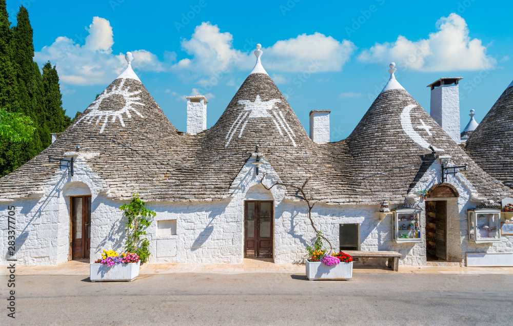 Fototapeta premium Scenic sight in Alberobello, the famous Trulli village in Puglia (Apulia), southern Italy.