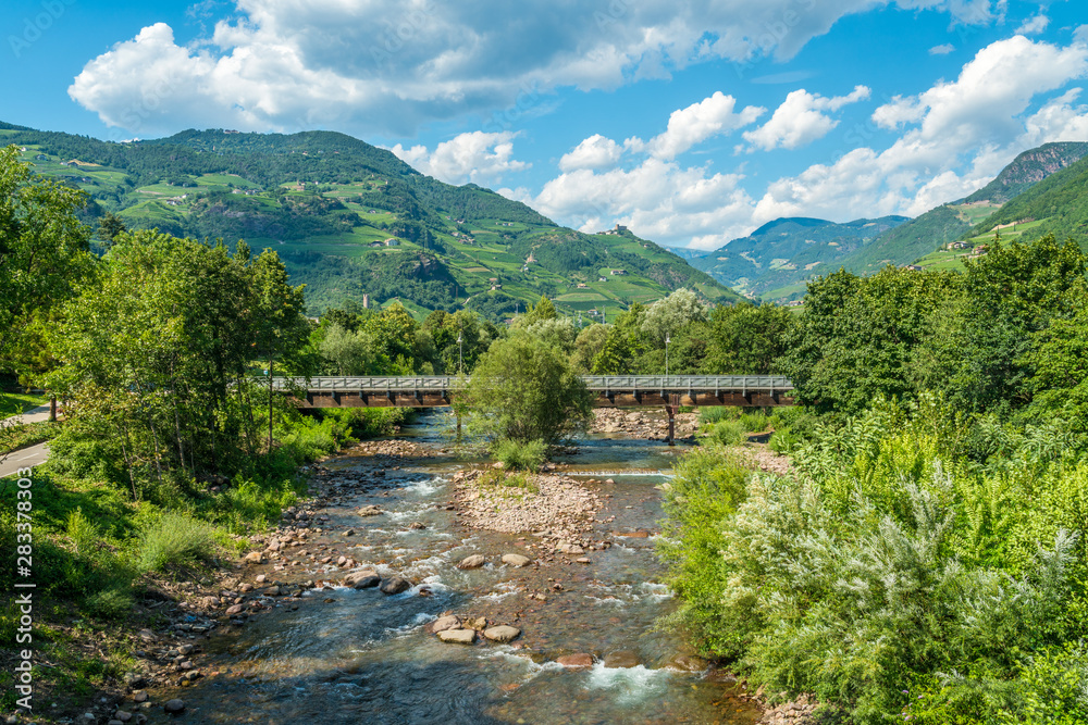 Idyllic mountain panorama in Bolzano from Talvera Bridge, Trentino Alto Adige, Italy.