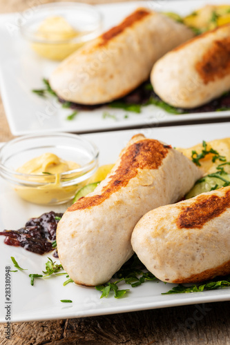 bayerische gegrillte Wollwurst mit Kartoffelsalat photo