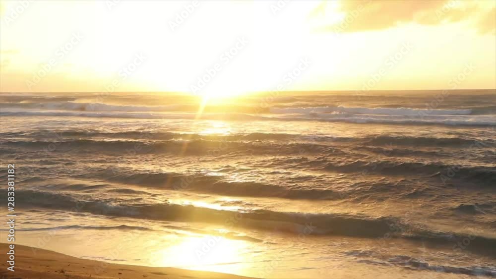 Golden Hour Sunset over rolling waves