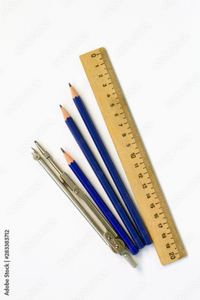 wooden ruler and pencils isolated on white background top view wooden ruler and pencils isolated on white background top view