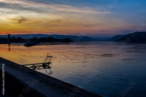 Danube River beautiful blue hour view near Kladovo Marina with an old neglected diving platform, in Kladovo , Serbia © Stanislava