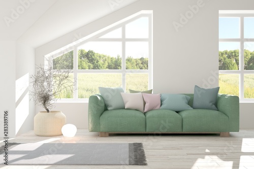 Stylish room in white color with sofa and summer landscape in window. Scandinavian interior design. 3D illustration © AntonSh