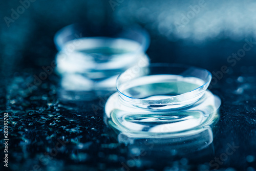 Two contact lenses with reflections...