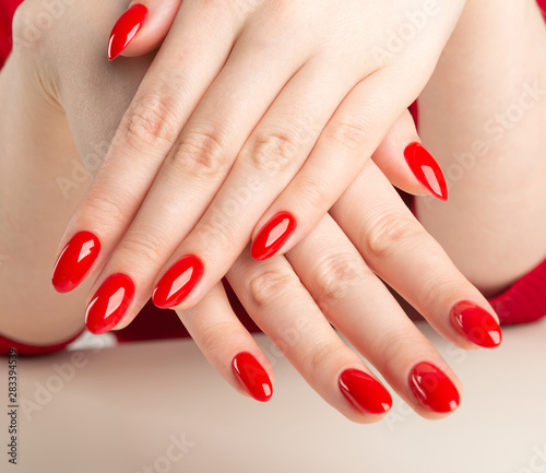 hands with red manicure.