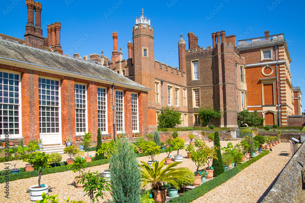 Fototapeta premium London, UK. English garden view and the East Front of Hampton court 17th century locates West London