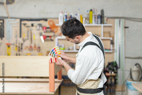 Small-Sized Companies, furniture and worker concept - Handsome young man working in the furniture factory