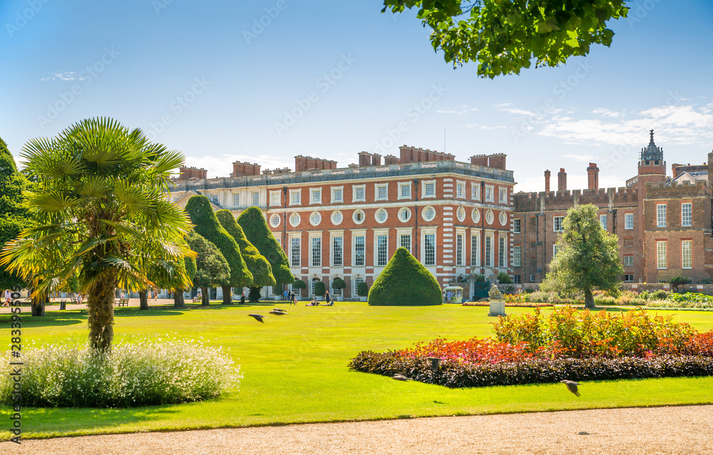 Fototapeta premium London, UK. English garden view and the East Front of Hampton court 17th century locates West London