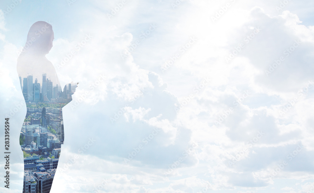 Business woman makes calculations in front of beautiful sky. Global business, success and strategy concept Business woman makes calculations in front of beautiful sky. Global business, success and strategy concept