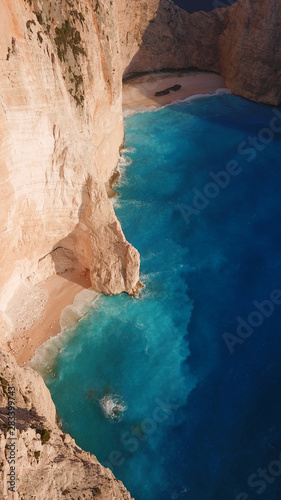 Aerial drone view of iconic beach of Navagio or Shipwreck voted one of the most beautiful beaches in the world with deep turquoise clear sea  Zakynthos island  Ionian  Greece
