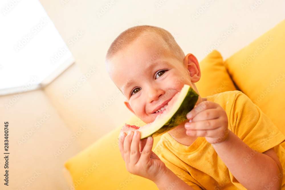 Cute little boy enjoy eating watermelon outside Cute little boy enjoy eating watermelon outside