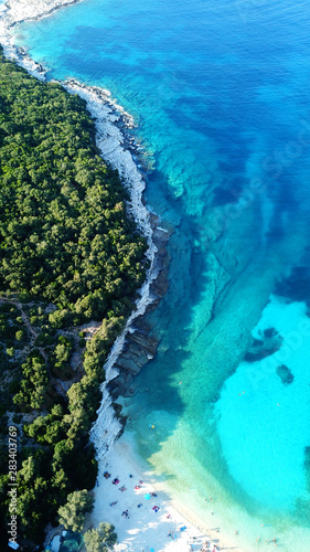 Aerial drone photo of tropical Caribbean bay with white sand beach and beautiful turquoise and sapphire clear sea