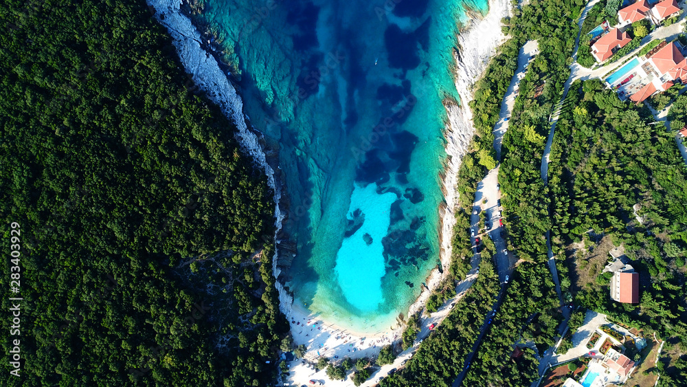 Aerial drone top view photo of exotic paradise beach of Emblisi with turquoise and emerald clear sea near iconic Fiskardo bay, Cefalonia island, Ionian, Greece