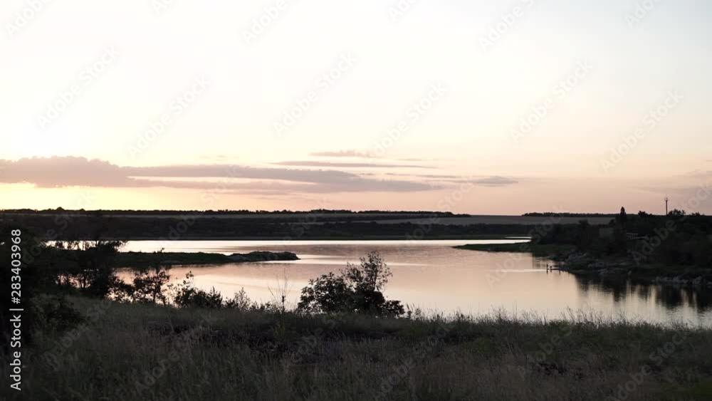 Beautiful warm sunset near the river. Beautiful sunset background