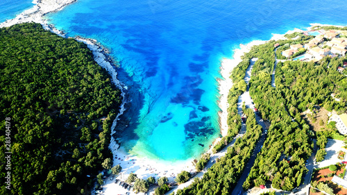 Aerial drone top view photo of exotic paradise beach of Emblisi with turquoise and emerald clear sea near iconic Fiskardo bay, Cefalonia island, Ionian, Greece