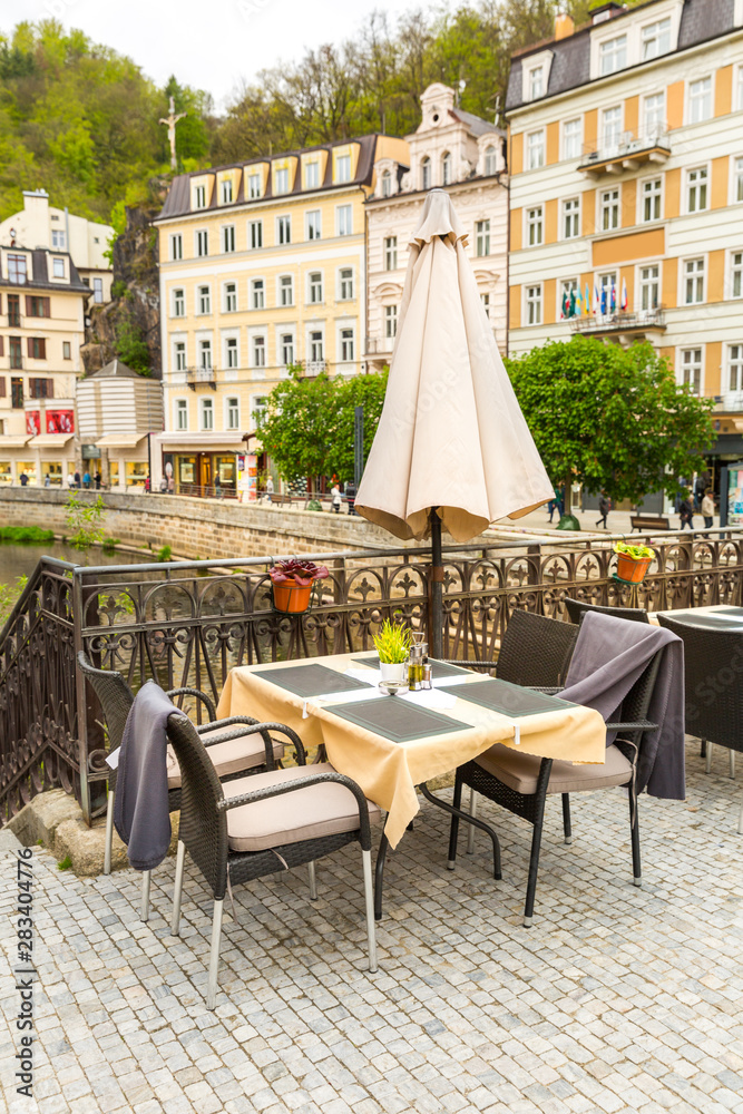 Cosy outdoor cafe with view on river, Karlovy Vary