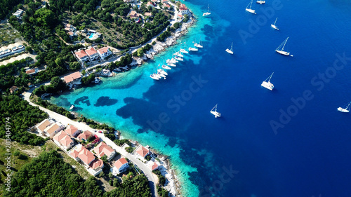 Aerial drone photo of picturesque and iconic port of Fiskardo with luxury boats docked and traditional character, Cefalonia island, Ionian, Greece