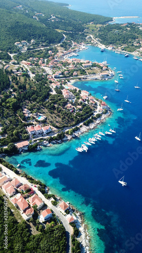 Aerial drone photo of picturesque and iconic port of Fiskardo with luxury boats docked and traditional character, Cefalonia island, Ionian, Greece