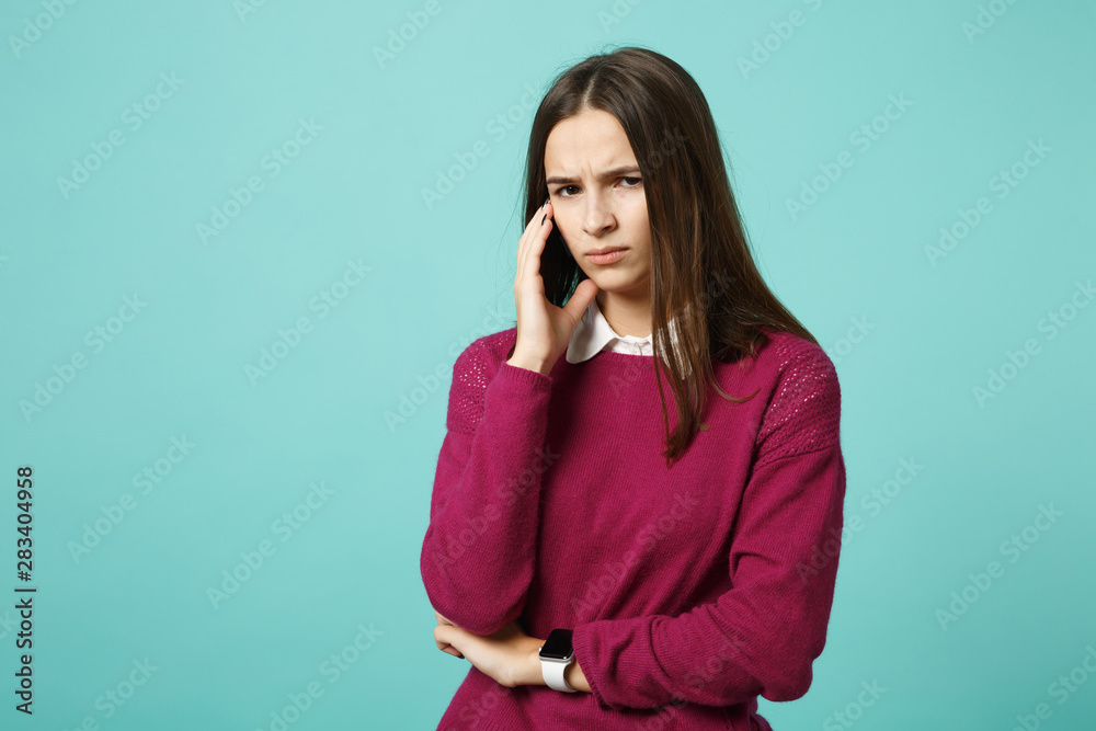 Young fun sad upset perplexed disturb brunette woman girl in red casual clothes posing isolated on blue wall background studio portrait. People sincere emotions lifestyle concept. Mock up copy space. Young fun sad upset perplexed disturb brunette woman girl in red casual clothes posing isolated on blue wall background studio portrait. People sincere emotions lifestyle concept. Mock up copy space.