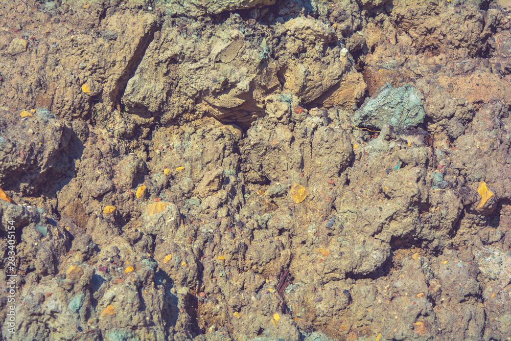 Loose rough dry clay mud with pebbles. Natural texture of dry brown dirty soil Loose rough dry clay mud with pebbles. Natural texture of dry brown dirty soil